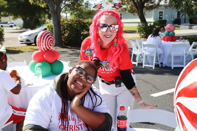 Melanie at a community Christmas celebration with a client
