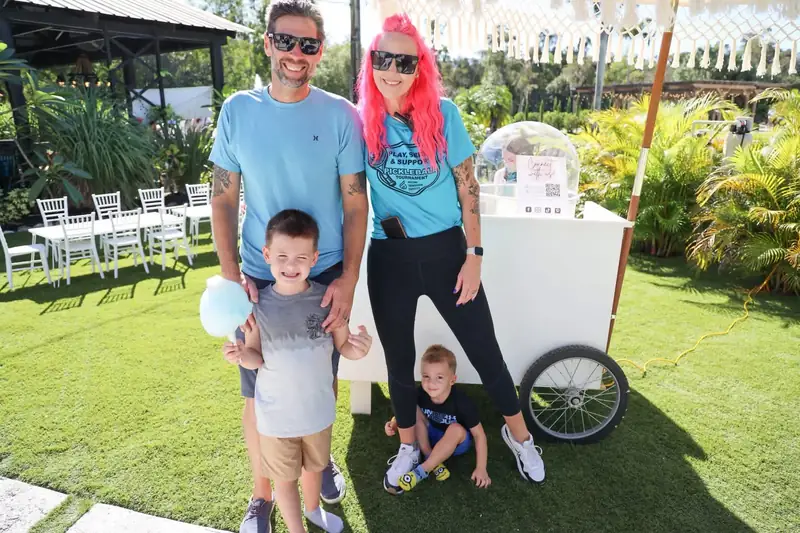 Melanie with a family at a Rising Tide community event